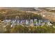 A beautiful aerial view of homes in a tree-lined community near the marsh at 3025 Penny Ln, Johns Island, SC 29455