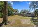 Large backyard featuring mature trees, green grass, a shed, and plenty of open space at 316 Anadale Ct, North Charleston, SC 29418