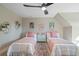 Charming bedroom boasts two beds, complemented by colorful decor and a stylish ceiling fan at 316 Anadale Ct, North Charleston, SC 29418