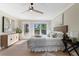 Inviting bedroom with a ceiling fan and view to the outdoors at 316 Anadale Ct, North Charleston, SC 29418