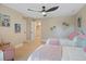 Bright bedroom featuring two beds, stylish decor, and a ceiling fan for added comfort at 316 Anadale Ct, North Charleston, SC 29418