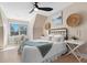 Bright bedroom featuring a comfortable bed, a desk, tasteful decor, and a modern ceiling fan at 316 Anadale Ct, North Charleston, SC 29418