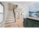 Bright and inviting foyer with staircase, beautiful floors, and modern design elements at 316 Anadale Ct, North Charleston, SC 29418
