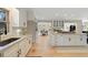Spacious kitchen with white cabinets, modern appliances, and hardwood floors at 316 Anadale Ct, North Charleston, SC 29418