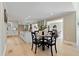 Open kitchen and dining space with an island and a table setting with chairs at 316 Anadale Ct, North Charleston, SC 29418