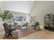 Bright living room with large windows, vaulted ceiling, and neutral decor at 316 Anadale Ct, North Charleston, SC 29418