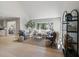 Open-concept living room featuring large windows and a decorative shelving unit at 316 Anadale Ct, North Charleston, SC 29418