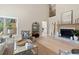 Comfortable living room with high ceilings, fireplace, and natural light at 316 Anadale Ct, North Charleston, SC 29418
