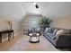 Bright living room features a high ceiling, neutral tones, stylish furnishings, and ample natural light at 316 Anadale Ct, North Charleston, SC 29418