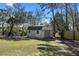 Backyard shed with roll-up door and double doors for outdoor storage and utility at 316 Anadale Ct, North Charleston, SC 29418