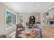 Comfortable sitting room with armchairs, a coffee table, view of the backyard, and shelf storage at 316 Anadale Ct, North Charleston, SC 29418