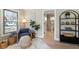 Cozy sitting area with an accent chair and view into the bathroom featuring tile floors and a comfort-height toilet at 316 Anadale Ct, North Charleston, SC 29418