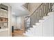 Stylish staircase featuring modern railings, hardwood steps, and a well-lit landing at 316 Anadale Ct, North Charleston, SC 29418