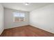 Bright bedroom with hardwood floors and natural light from a large window at 316 Knawl Road, Moncks Corner, SC 29461