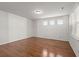 Bright bedroom with hardwood floors and natural light from multiple windows at 316 Knawl Road, Moncks Corner, SC 29461
