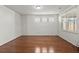 Spacious bedroom with hardwood floors, large windows, and plenty of natural light at 316 Knawl Road, Moncks Corner, SC 29461