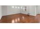 Spacious bedroom with hardwood floors, large windows, and plenty of natural light at 316 Knawl Road, Moncks Corner, SC 29461