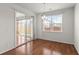 Bright dining room with hardwood floors and sliding glass doors to the sunroom at 316 Knawl Road, Moncks Corner, SC 29461