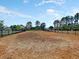Expansive, fenced dog park covered with wood chips providing a safe and fun area for pets to play at 316 Knawl Road, Moncks Corner, SC 29461