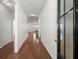 A bright hallway with hardwood floors leads to the main living area and bedrooms at 316 Knawl Road, Moncks Corner, SC 29461
