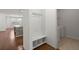 Hall tree with storage adjacent to the laundry room and view to the kitchen at 316 Knawl Road, Moncks Corner, SC 29461