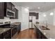 Kitchen featuring stainless steel appliances, dark cabinets, and a functional layout at 316 Knawl Road, Moncks Corner, SC 29461