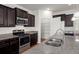 Stylish kitchen with stainless steel appliances, dark cabinetry, and ample counter space at 316 Knawl Road, Moncks Corner, SC 29461