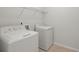 Functional laundry room featuring a Hotpoint washer and dryer at 316 Knawl Road, Moncks Corner, SC 29461