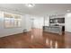 Open concept living area with hardwood floors, bright light and view to kitchen island at 316 Knawl Road, Moncks Corner, SC 29461