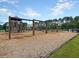 Community playground featuring a slide, swings, climbing area and a wood chip safety surface at 316 Knawl Road, Moncks Corner, SC 29461