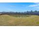 Scenic view of a serene pond surrounded by lush grass and a dense tree line on a clear day at 316 Knawl Road, Moncks Corner, SC 29461