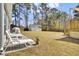 Spacious backyard featuring well-maintained lawn, patio seating, storage shed, and mature trees at 3473 Plow Ground Rd, Johns Island, SC 29455