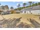 Expansive backyard with a solar-paneled house, inviting seating, and a pool for outdoor enjoyment at 3473 Plow Ground Rd, Johns Island, SC 29455