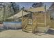 Backyard pool area with a wooden deck, sunshade, and fenced yard for summer fun at 3473 Plow Ground Rd, Johns Island, SC 29455