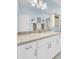 Bathroom featuring tiled shower with a seashell-themed curtain and white vanity with granite countertop at 3473 Plow Ground Rd, Johns Island, SC 29455