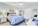 Bedroom featuring a ceiling fan, white closet doors, and bedside table with nautical decor accents at 3473 Plow Ground Rd, Johns Island, SC 29455