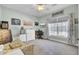Bedroom featuring a large window for natural light with a ceiling fan and comfortable seating at 3473 Plow Ground Rd, Johns Island, SC 29455