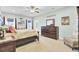 Beautiful bedroom features calming colors, a ceiling fan, and beach-themed decor for relaxation at 3473 Plow Ground Rd, Johns Island, SC 29455