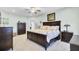 Spacious bedroom features a dark wood bed frame with matching dresser and a light, neutral carpet at 3473 Plow Ground Rd, Johns Island, SC 29455
