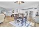 Open dining area featuring wood floors and connection to the modern kitchen at 3473 Plow Ground Rd, Johns Island, SC 29455