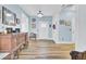 Foyer featuring wood floors, blue walls, and chandelier lighting, creating a welcoming entryway at 3473 Plow Ground Rd, Johns Island, SC 29455