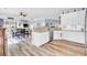 Open-concept kitchen with stainless steel appliances, granite counters, and plenty of natural light at 3473 Plow Ground Rd, Johns Island, SC 29455