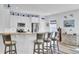 Kitchen with breakfast bar, wood floors, white cabinets, and stainless steel appliances at 3473 Plow Ground Rd, Johns Island, SC 29455