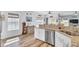 Stylish kitchen with stainless steel appliances, granite countertops, and wooden floors at 3473 Plow Ground Rd, Johns Island, SC 29455