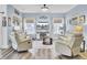 Cozy living room featuring comfortable seating, a fireplace, and a ceiling fan for relaxed living at 3473 Plow Ground Rd, Johns Island, SC 29455