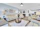 Inviting living room offering wood floors, a ceiling fan, comfortable seating, and relaxing atmosphere at 3473 Plow Ground Rd, Johns Island, SC 29455