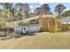 Above-ground pool with a wooden deck, shaded by a canopy, surrounded by a fenced yard at 3473 Plow Ground Rd, Johns Island, SC 29455