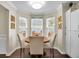 Cozy dining area featuring a round table with upholstered chairs and bright lighting at 3545 Rookwood Pl, Johns Island, SC 29455