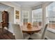 Bright dining area with natural light, wooden table, and seating for four at 3545 Rookwood Pl, Johns Island, SC 29455