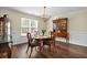 Elegant dining room featuring a classic hutch, hardwood floors, and natural light at 3545 Rookwood Pl, Johns Island, SC 29455